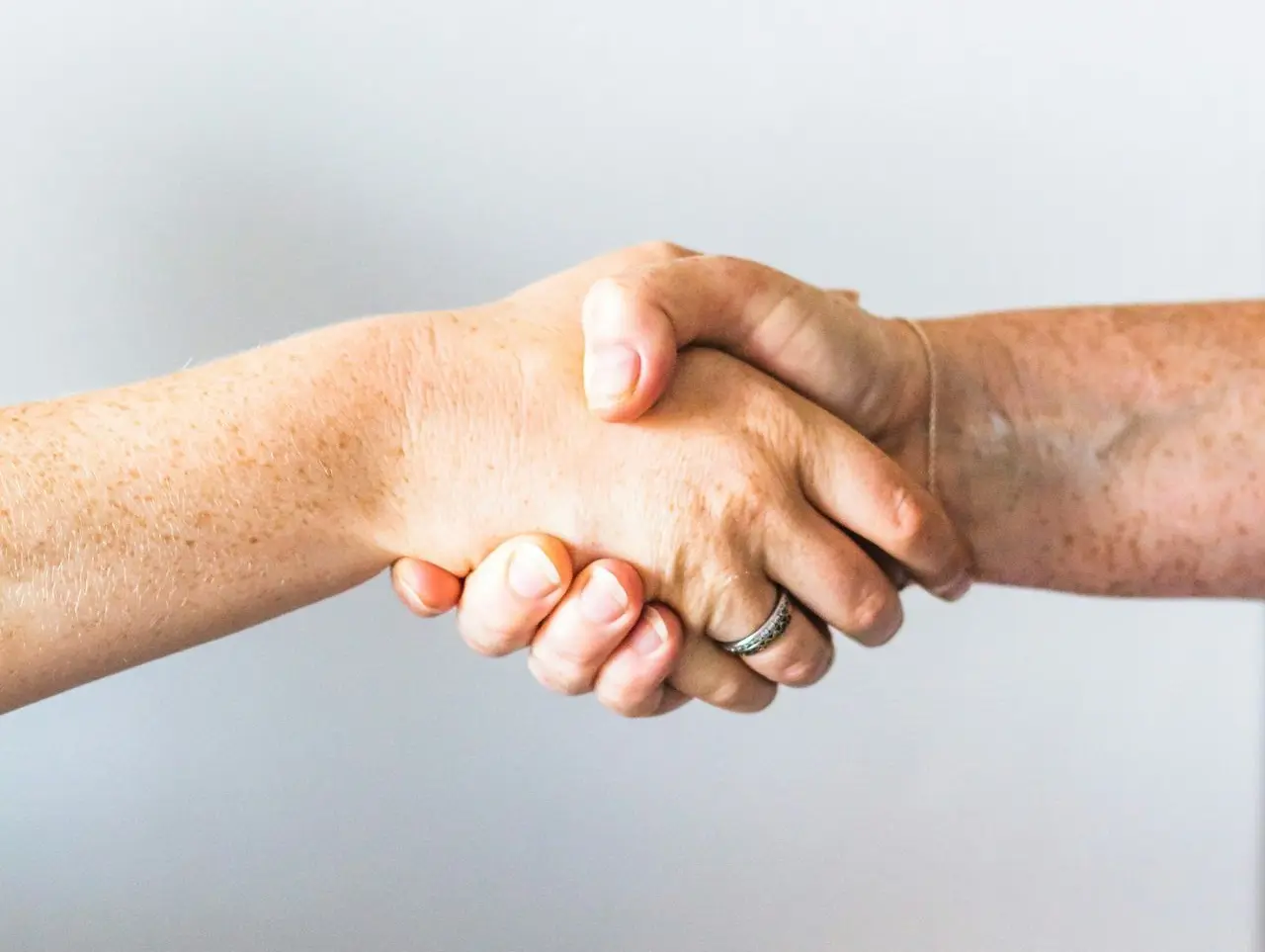 person holding hands of another person